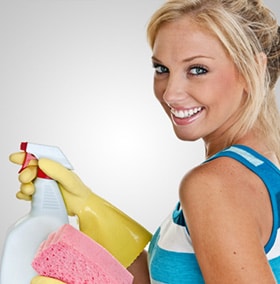woman-with-cleaning-supplies-gloves